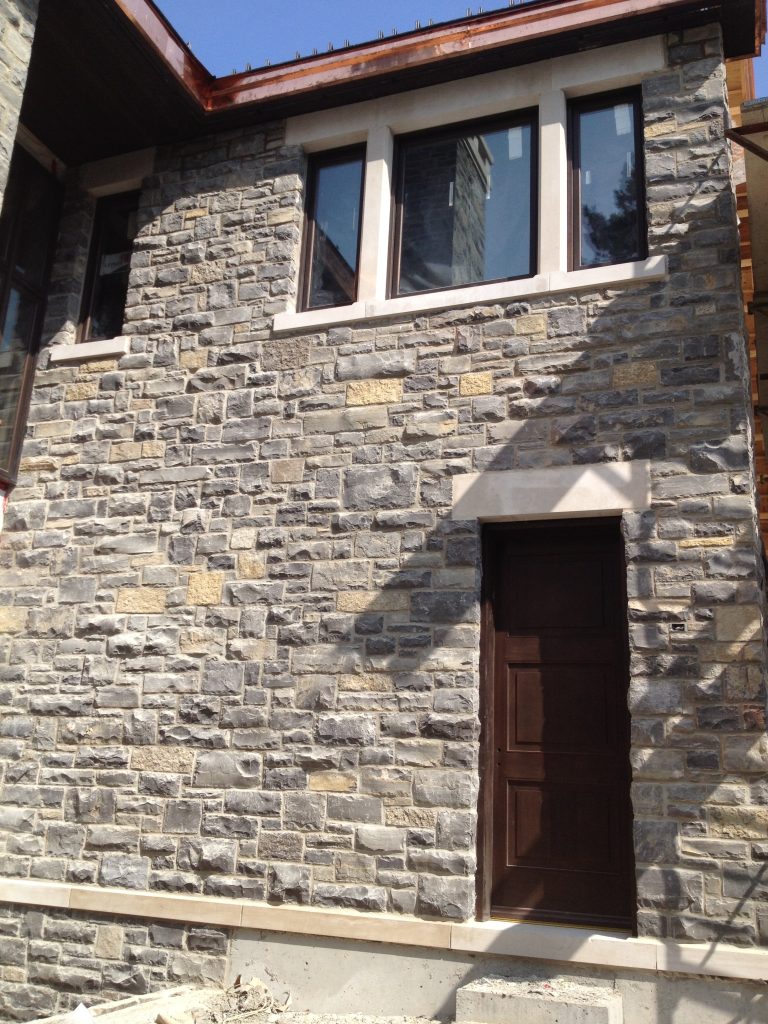 Unique Stone Window Accennts on Stone Home